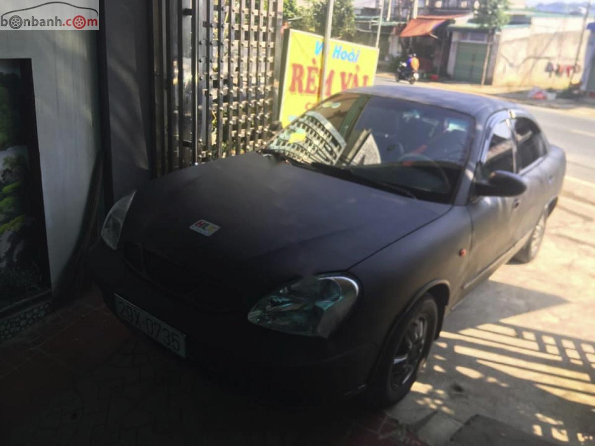 Daewoo Nubira II 2.0 2004 - Bán ô tô Daewoo Nubira II 2.0 đời 2004, màu đen, giá tốt