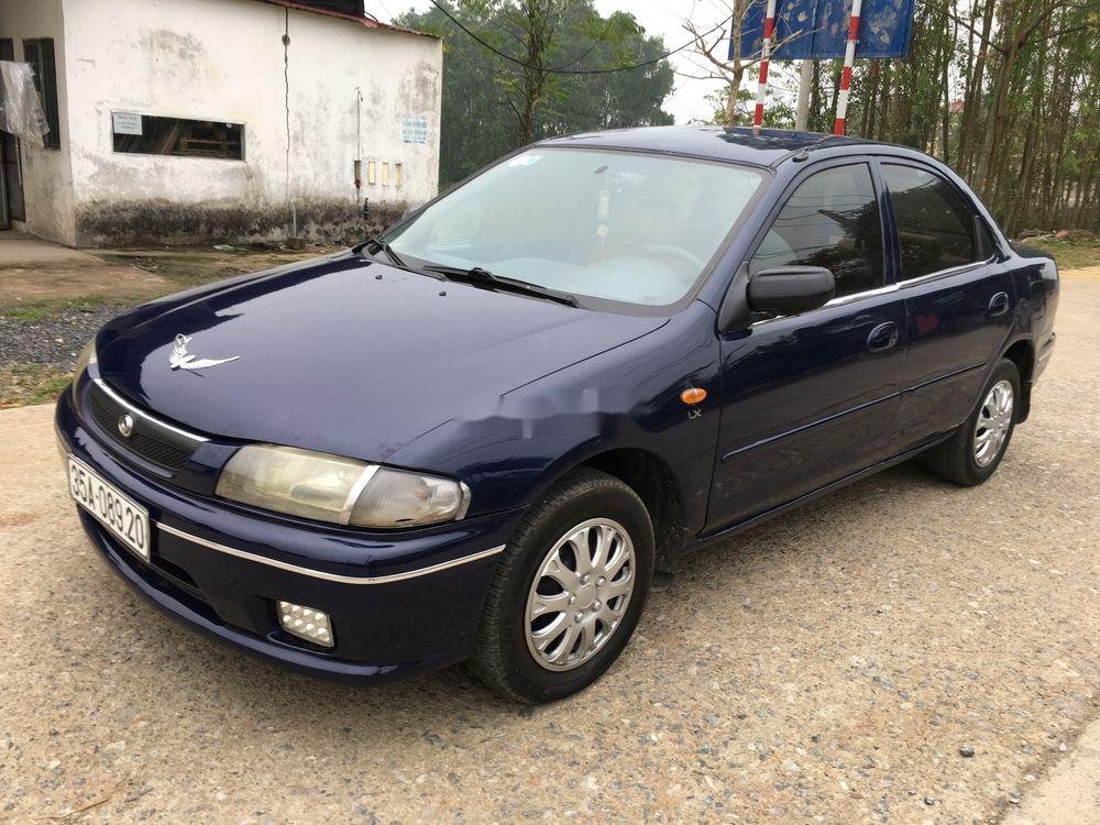 Mazda 323 2000 - Cần bán lại xe Mazda 323 đời 2000, màu xanh lam