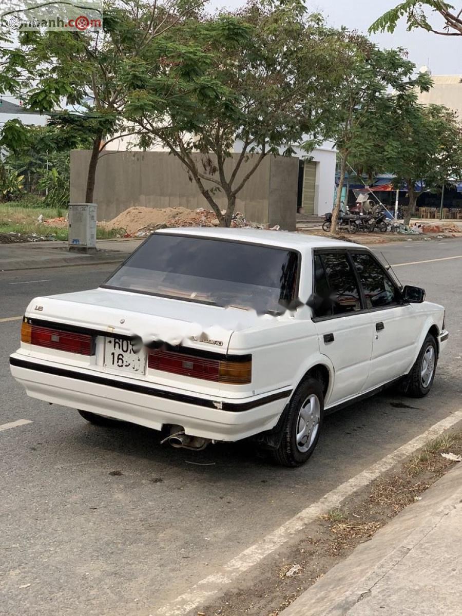 Nissan Bluebird 1.8   1990 - Cần bán Nissan Bluebird 1.8 đời 1990, màu trắng, xe nhập số sàn