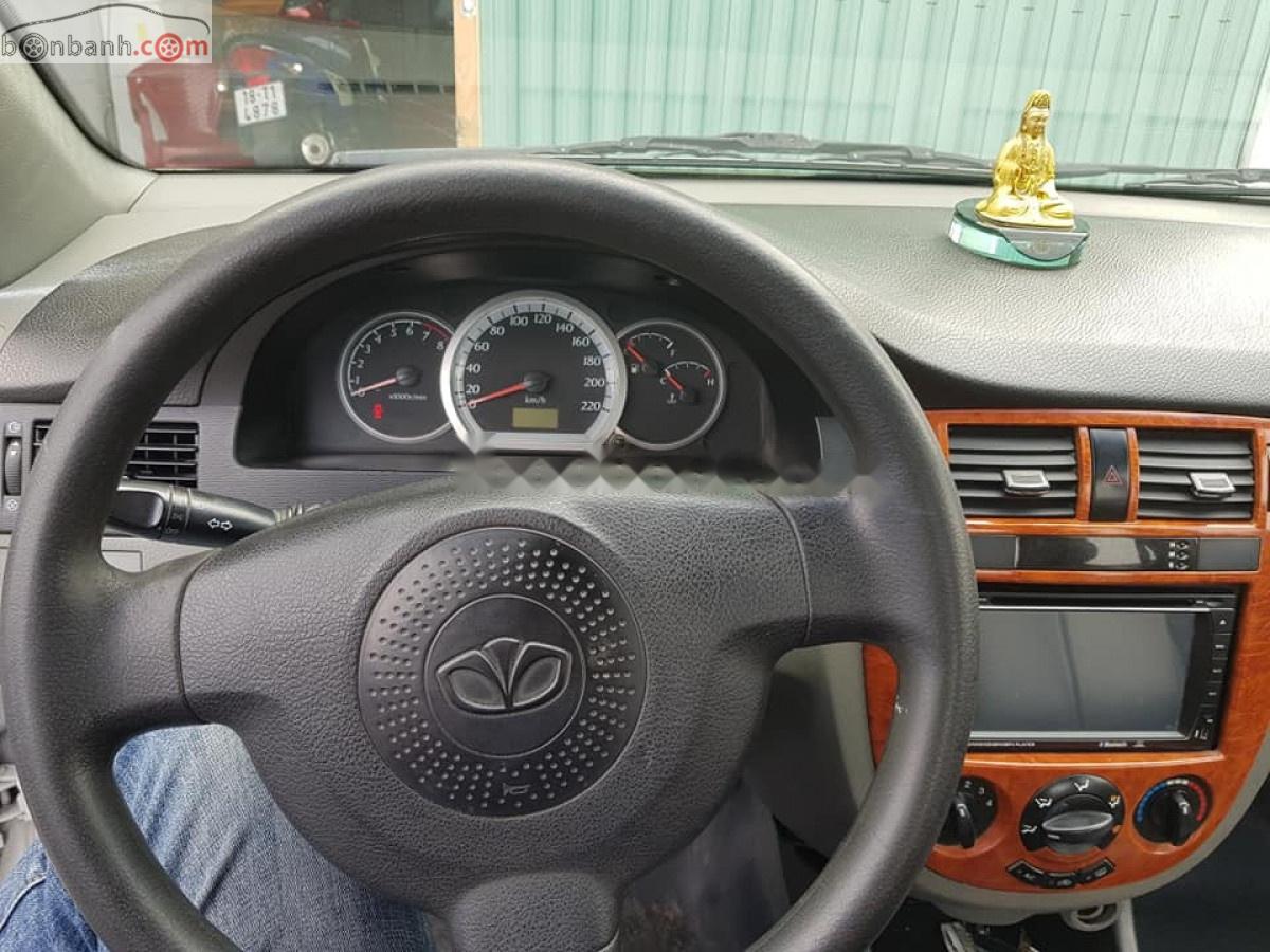 Daewoo Lacetti EX 1.6 MT 2005 - Cần bán lại xe Daewoo Lacetti EX 1.6 MT sản xuất năm 2005, màu trắng xe gia đình, 118tr