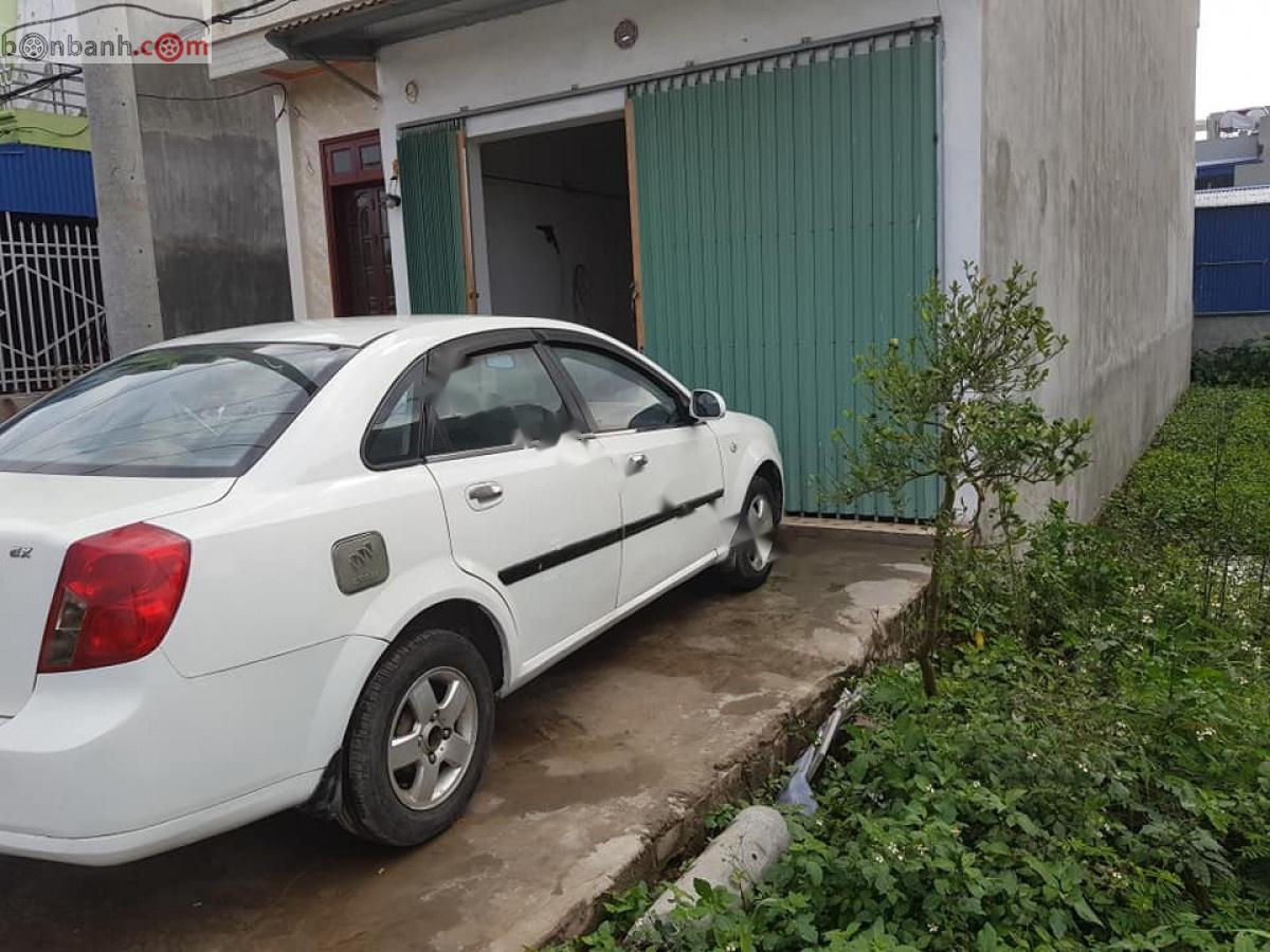 Daewoo Lacetti EX 1.6 MT 2005 - Cần bán lại xe Daewoo Lacetti EX 1.6 MT sản xuất năm 2005, màu trắng xe gia đình, 118tr