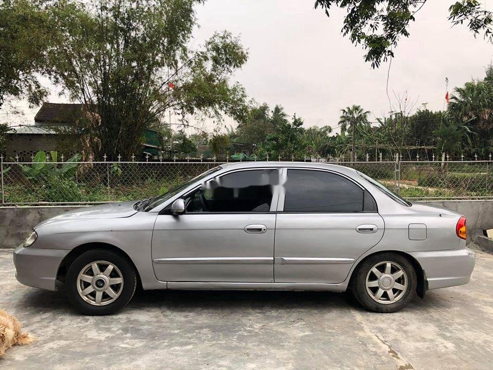 Kia Spectra 2004 - Cần bán gấp Kia Spectra năm 2004, màu bạc xe gia đình, 95tr