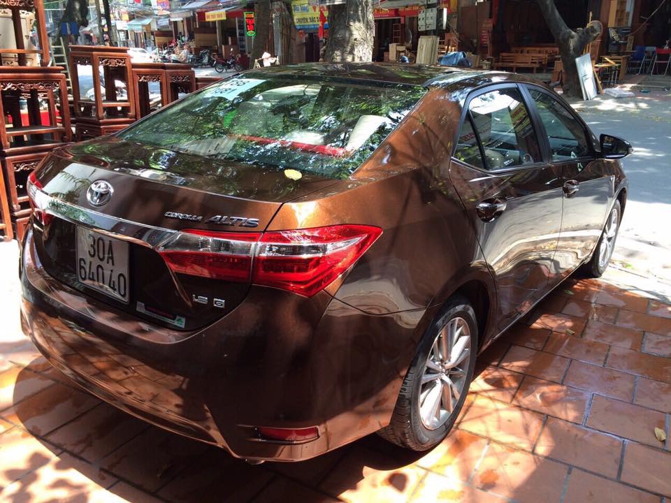 Toyota Corolla altis 2015 - Cần bán xe Toyota Corolla Altis 1.8G MT đời 2015, màu nâu, giá tốt