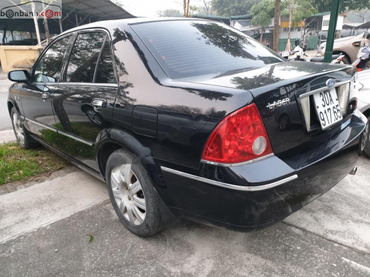 Ford Laser 1.8 AT ghia 2005 - Bán Ford Laser 1.8 AT ghia đời 2005, màu đen số tự động, giá chỉ 199 triệu