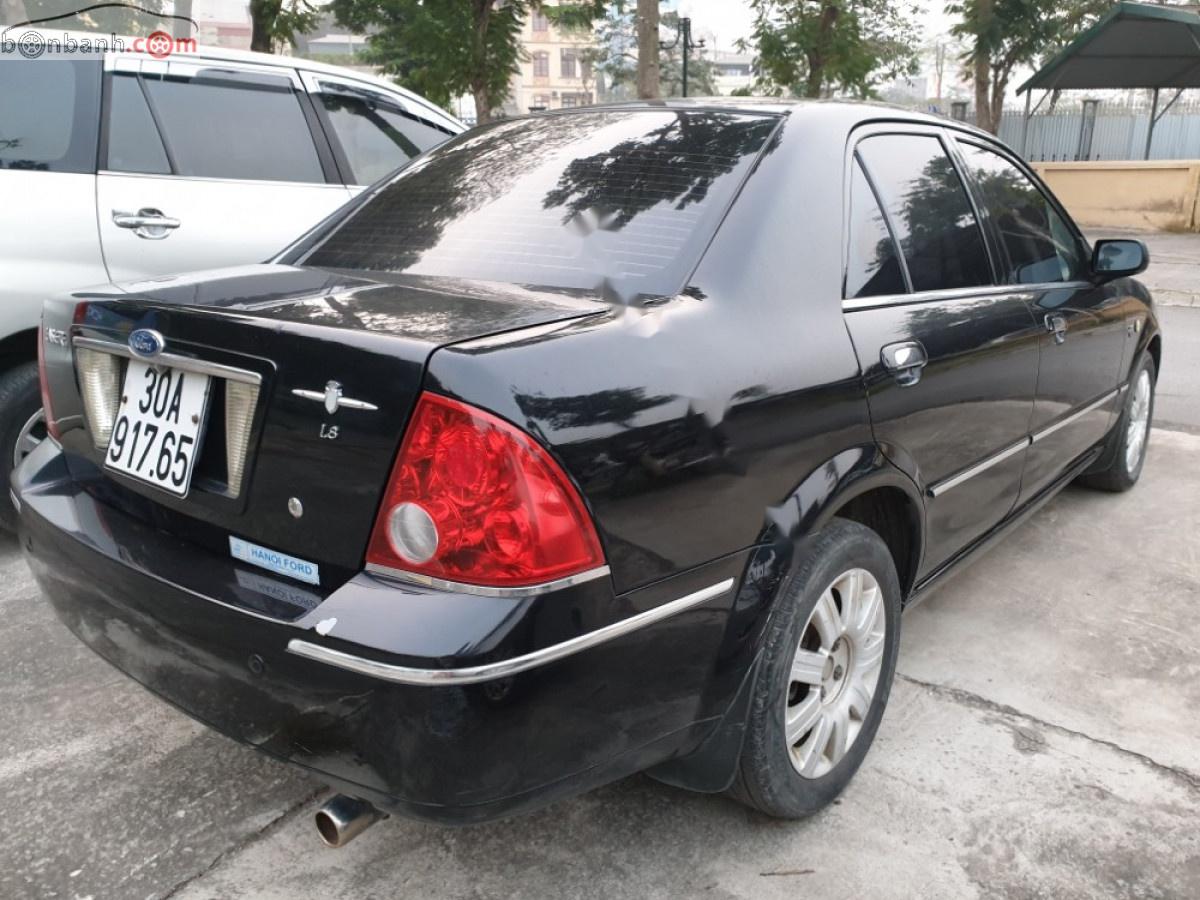 Ford Laser 1.8 AT ghia 2005 - Bán Ford Laser 1.8 AT ghia đời 2005, màu đen số tự động, giá chỉ 199 triệu