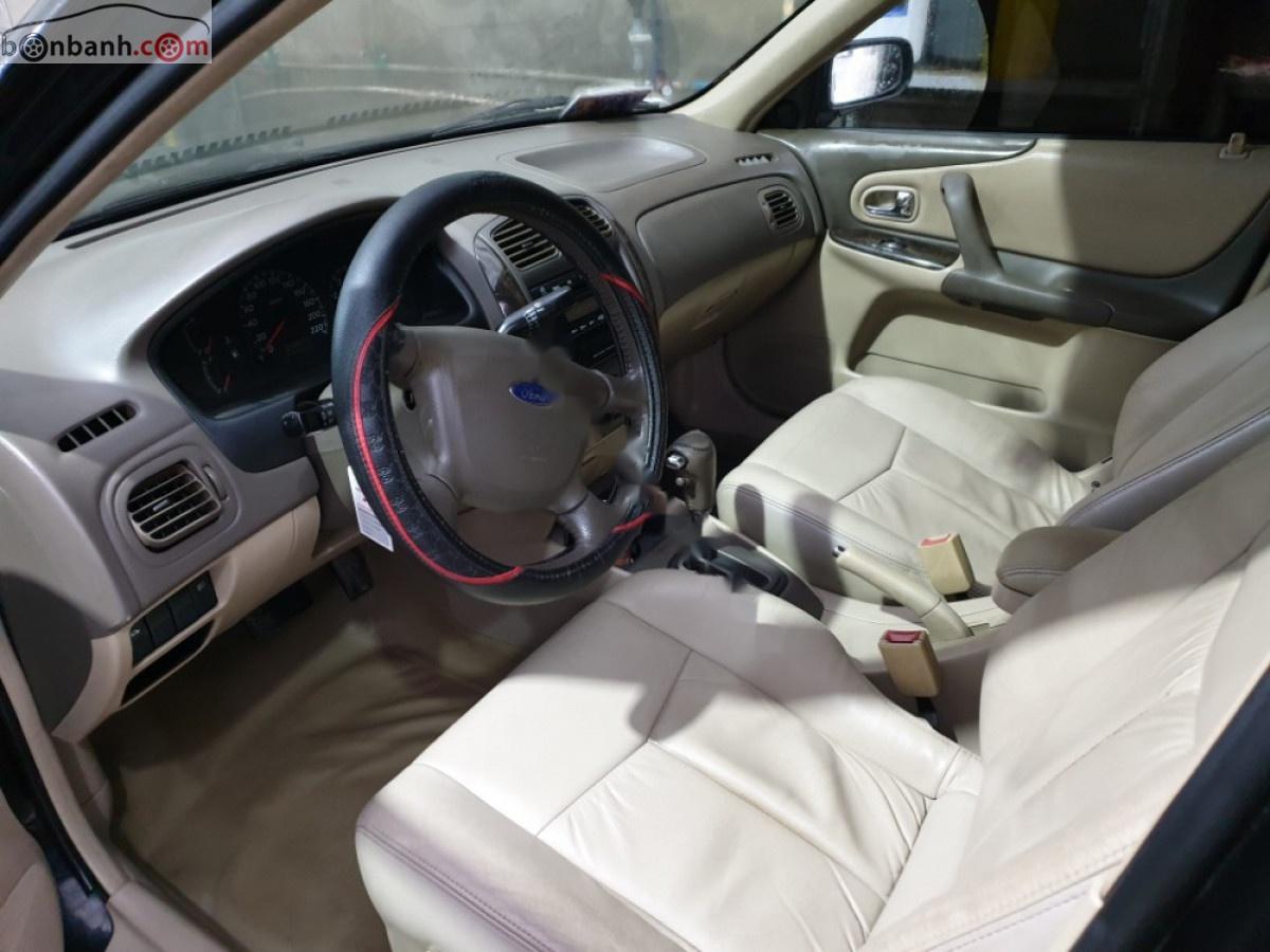 Ford Laser 1.8 AT ghia 2005 - Bán Ford Laser 1.8 AT ghia đời 2005, màu đen số tự động, giá chỉ 199 triệu