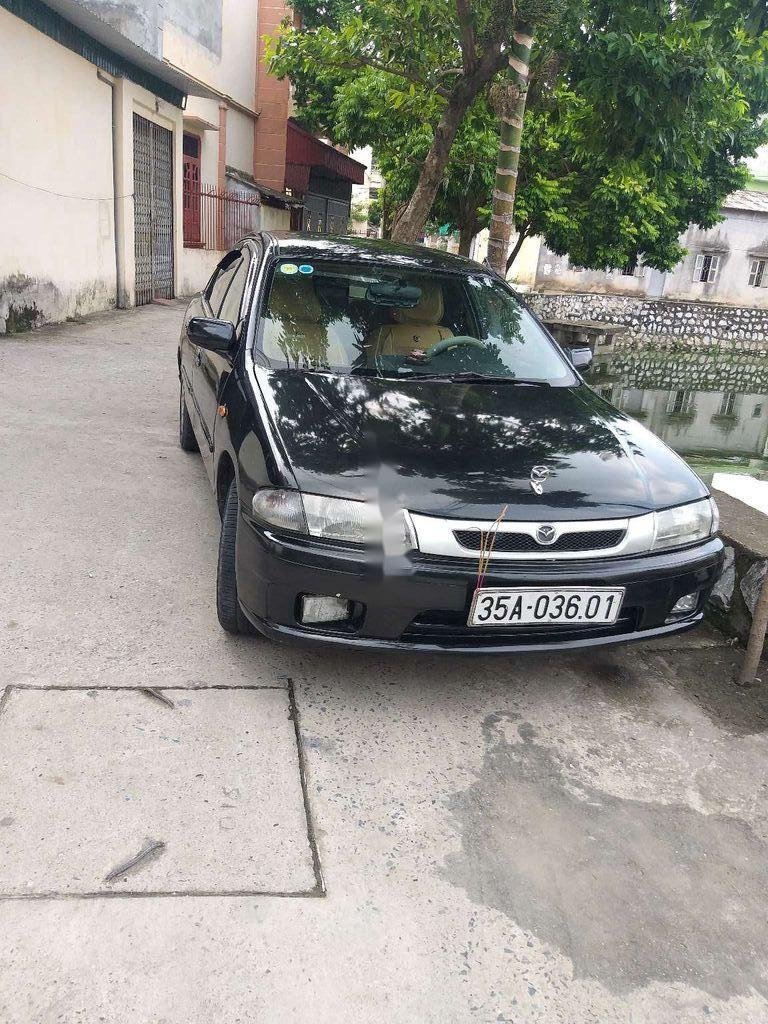 Mazda 323F   2000 - Cần bán Mazda 323F năm sản xuất 2000, màu đen, xe gia đình