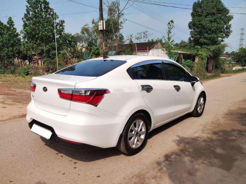 Kia Rio 2015 - Bán ô tô Kia Rio AT đời 2015, màu trắng, nhập khẩu nguyên chiếc xe gia đình