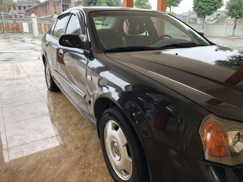 Daewoo Magnus   2004 - Bán Daewoo Magnus đời 2004, màu đen, 135 triệu