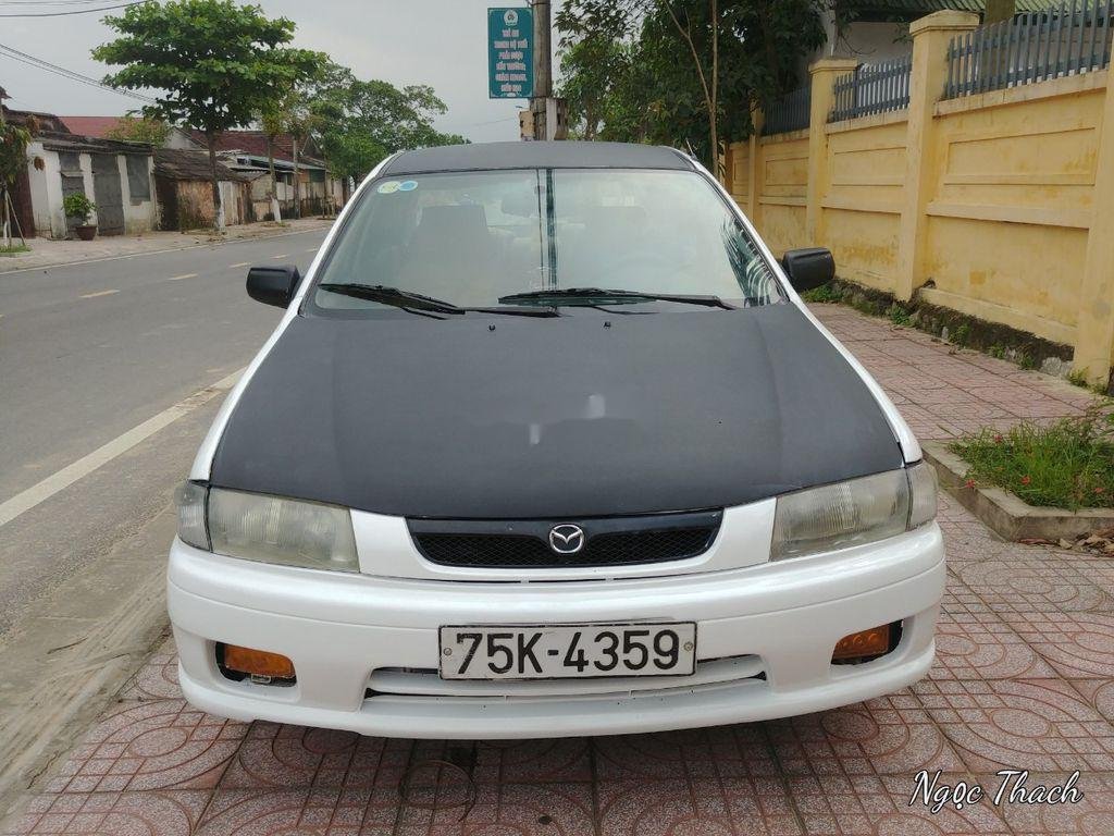 Mazda 323   2000 - Cần bán xe Mazda 323 năm 2000, hai màu trắng đen  