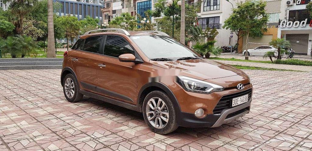 Hyundai i20 Active  1.4 AT 2015 - Cần bán gấp Hyundai i20 Active 1.4 AT 2015, màu vàng đồng, xe nhập, giá 485tr