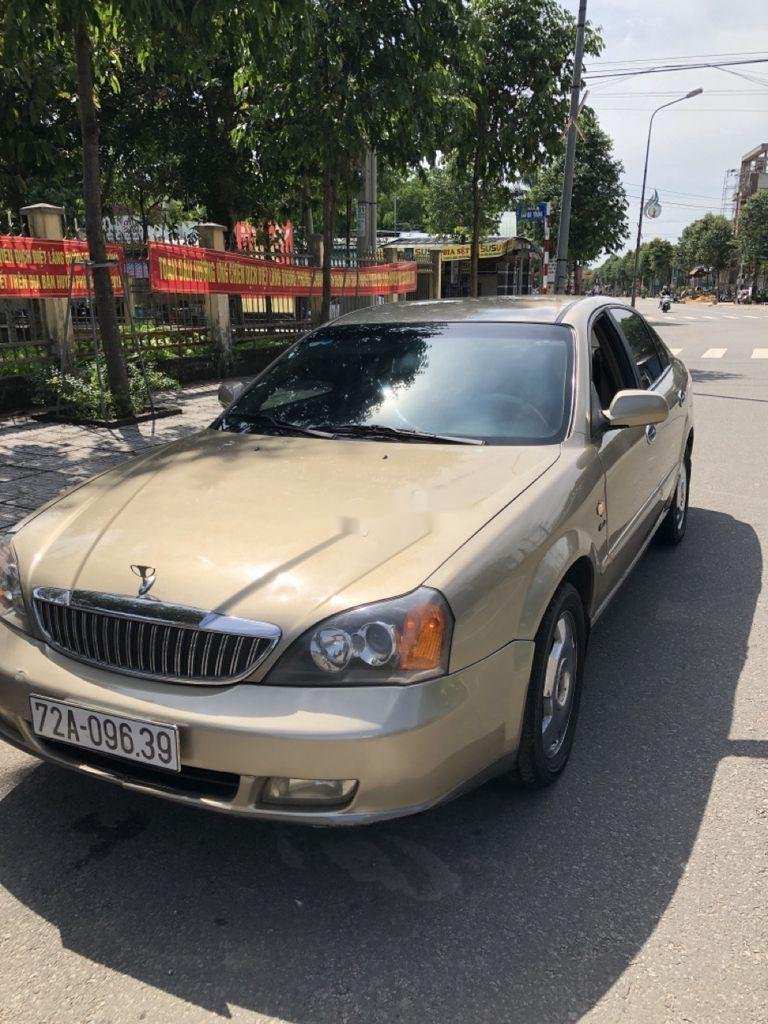 Daewoo Magnus   2004 - Cần bán xe Daewoo Magnus đời 2004 màu ghi vàng, 155tr