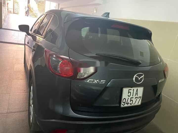 Mazda CX 5   2014 - Cần bán lại xe Mazda CX 5 năm sản xuất 2014, màu đen, 580 triệu