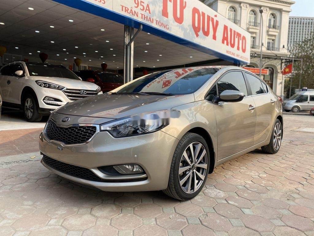 Kia K3   2015 - Cần bán xe Kia K3 1.6AT đời 2015, màu vàng cát, giá tốt