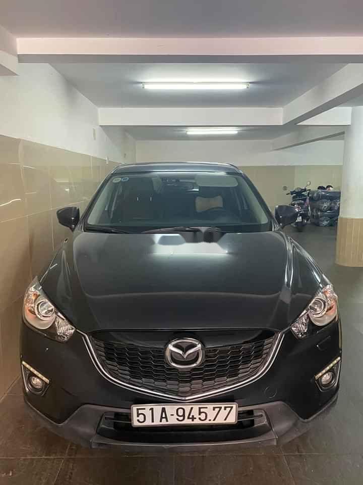 Mazda CX 5   2014 - Cần bán lại xe Mazda CX 5 năm sản xuất 2014, màu đen, 580 triệu