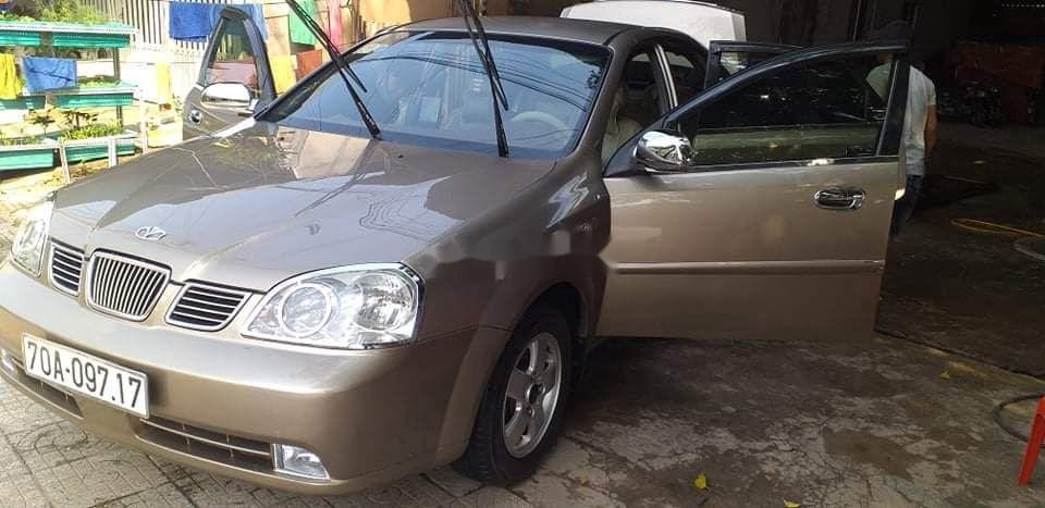 Daewoo Lacetti 2005 - Cần bán Daewoo Lacetti năm sản xuất 2005, màu vàng, xe nhập, 150tr