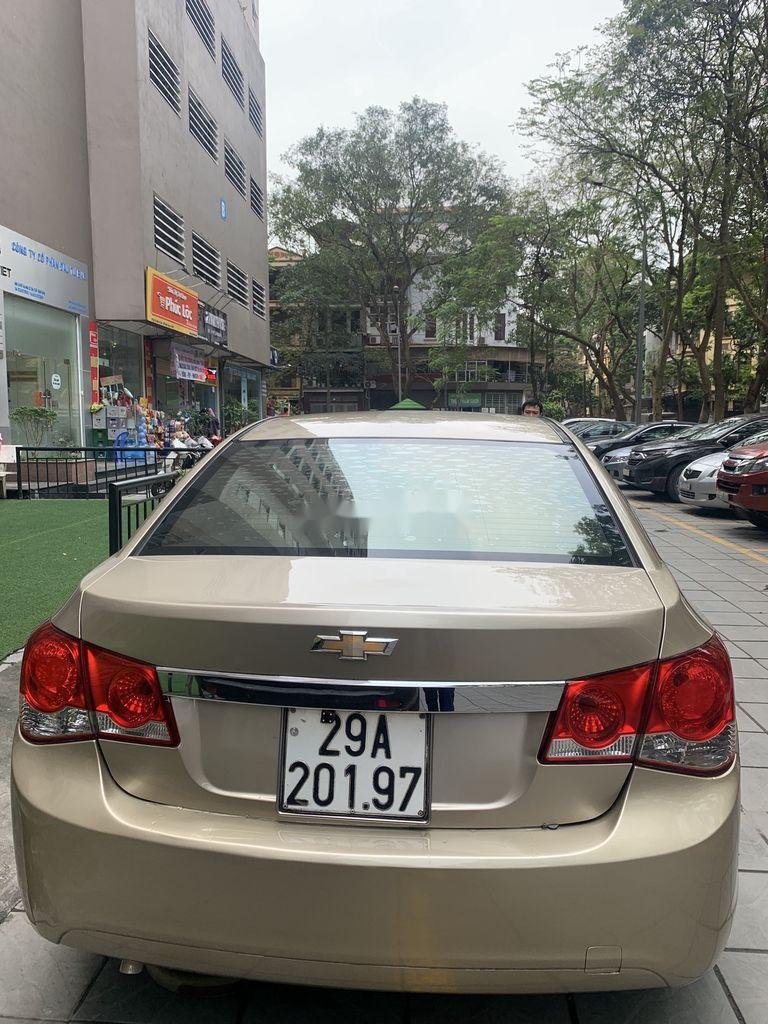 Chevrolet Cruze 2011 - Cần bán gấp Chevrolet Cruze MT đời 2012, màu vàng, nhập khẩu xe gia đình