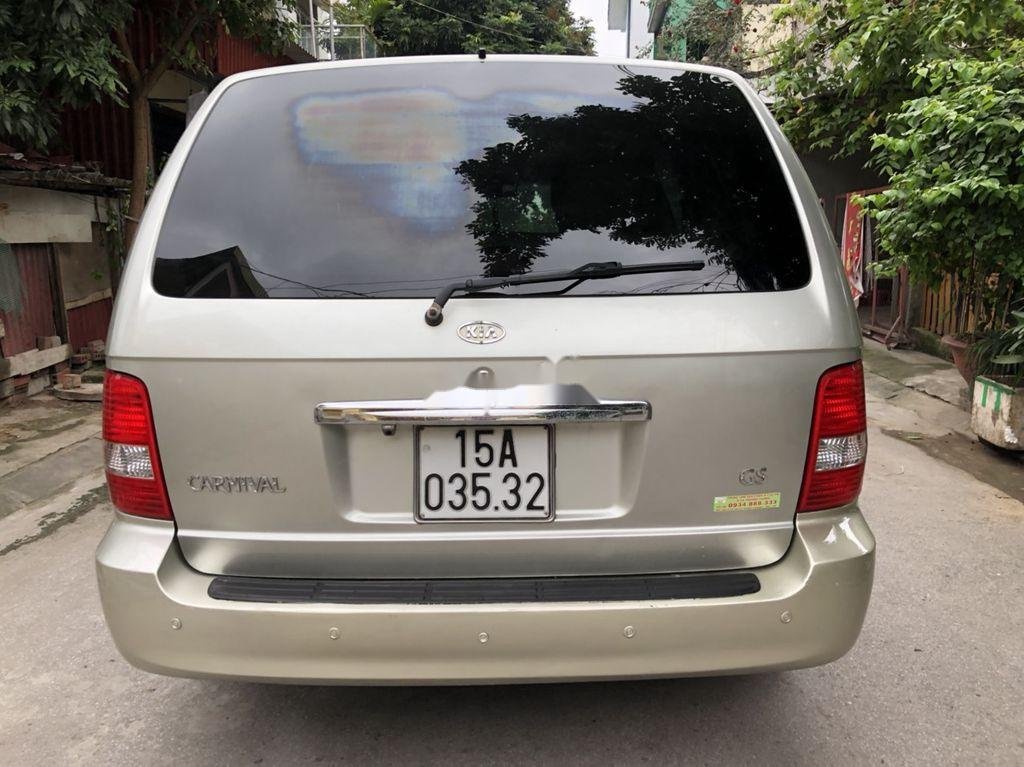 Kia Carnival 2009 - Bán xe Kia Carnival GS AT sản xuất 2009, màu vàng chính chủ