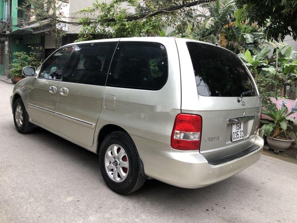 Kia Carnival 2009 - Bán xe Kia Carnival GS AT sản xuất 2009, màu vàng chính chủ