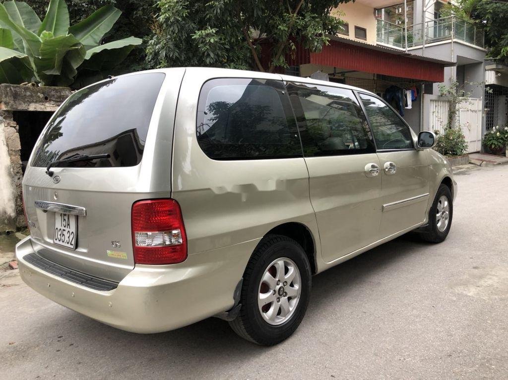 Kia Carnival 2009 - Bán xe Kia Carnival GS AT sản xuất 2009, màu vàng chính chủ