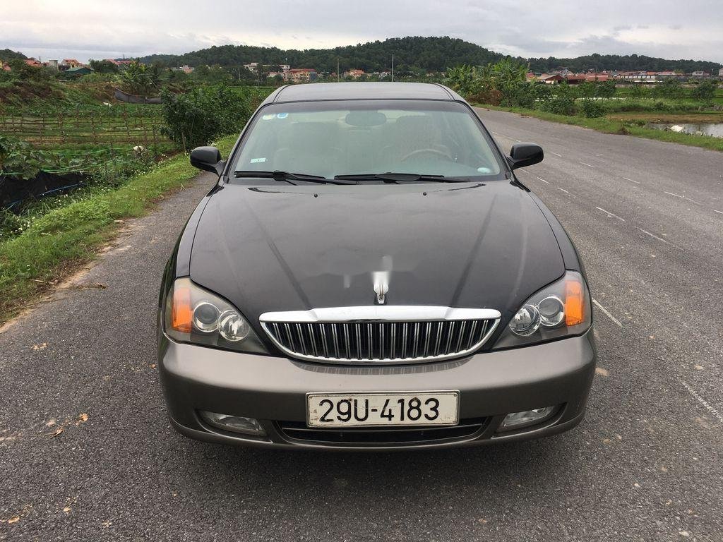 Daewoo Magnus 2004 - Cần bán xe Daewoo Magnus đời 2004, màu đen giá cạnh tranh