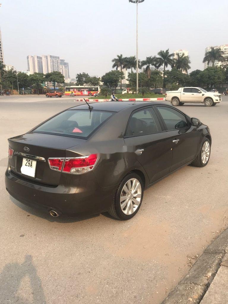 Kia Cerato   2011 - Cần bán xe Kia Cerato AT năm sản xuất 2011, màu đen, xe nhập số tự động