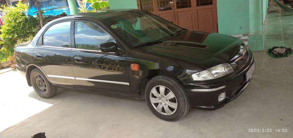 Mazda 323   2000 - Cần bán xe cũ Mazda 323 2000, màu đen, xe nhập 