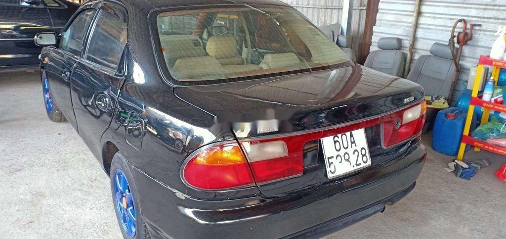 Mazda 323 2000 - Bán Mazda 323 sản xuất năm 2000, màu đen, giá chỉ 86 triệu