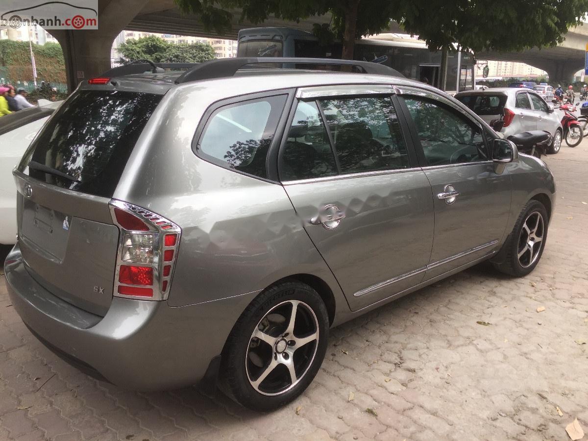 Kia Carens   2010 - Bán xe cũ Kia Carens SX 2.0 AT đời 2010, màu nâu