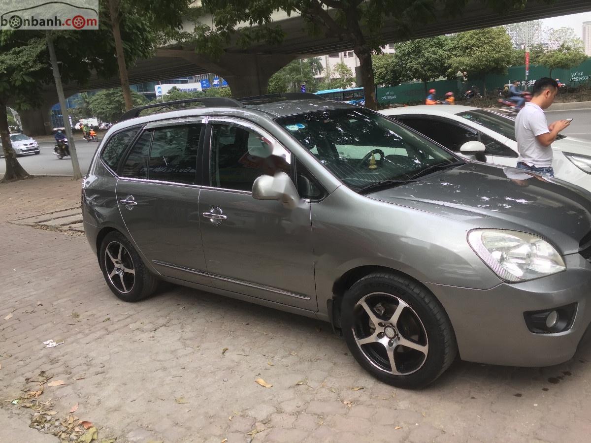 Kia Carens   2010 - Bán xe cũ Kia Carens SX 2.0 AT đời 2010, màu nâu