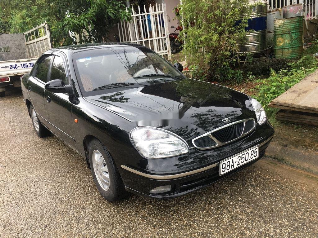 Daewoo Nubira   2003 - Bán Daewoo Nubira đời 2003, màu đen, số tự động, 75 triệu