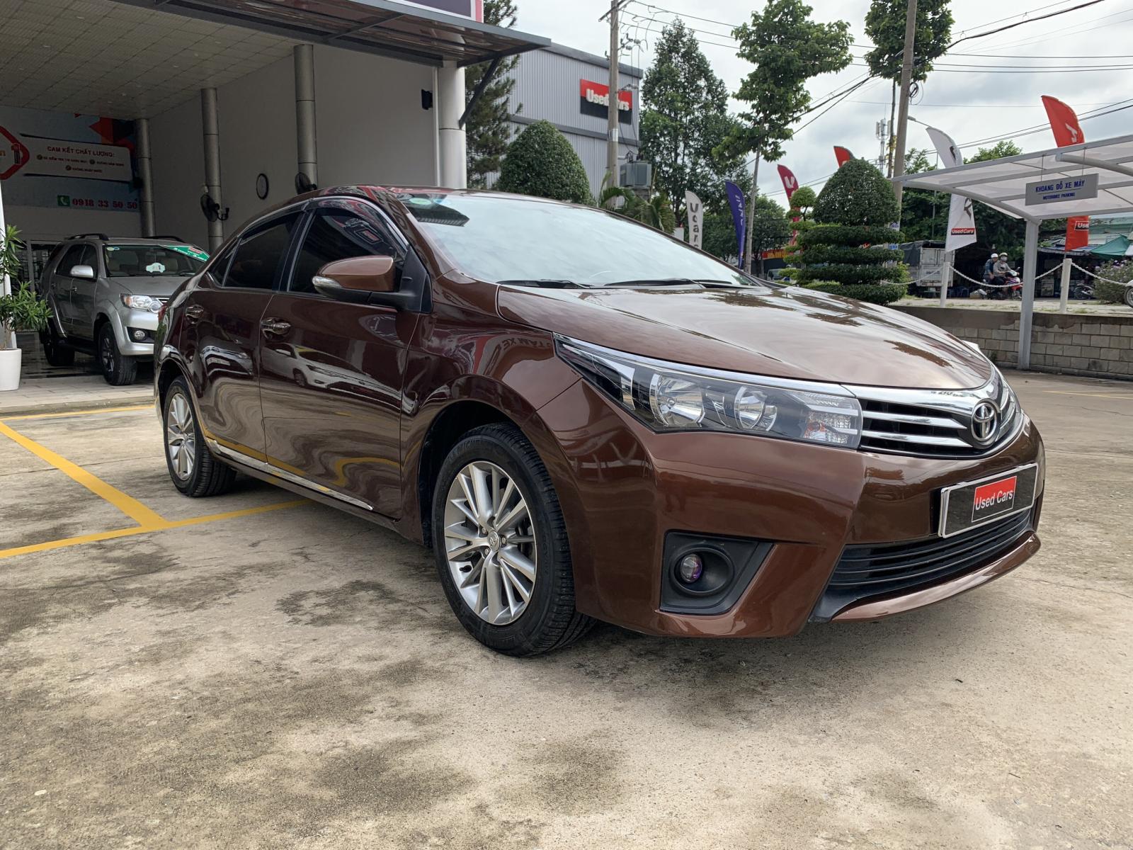 Toyota Corolla altis 1.8G 2014 - Xe Toyota Corolla altis 1.8G đời 2014, màu nâu, 590 triệu