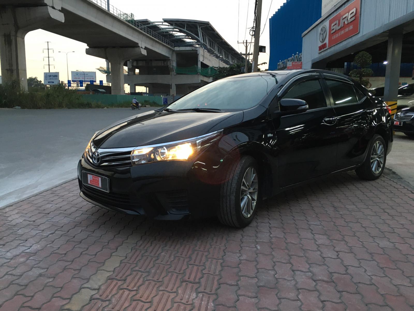 Toyota Corolla altis 1.8G MT 2014 - Cần bán lại xe Toyota Corolla altis 1.8G MT đời 2014, màu đen