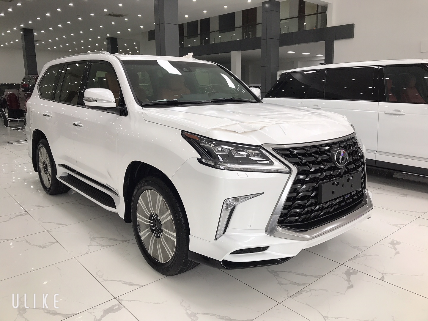 Lexus LX 570 2021 - Viet Auto Luxury Giao ngay Lexus LX570 MBS 4 ghế Vip massage 2021 màu trắng nội thất nâu da bò