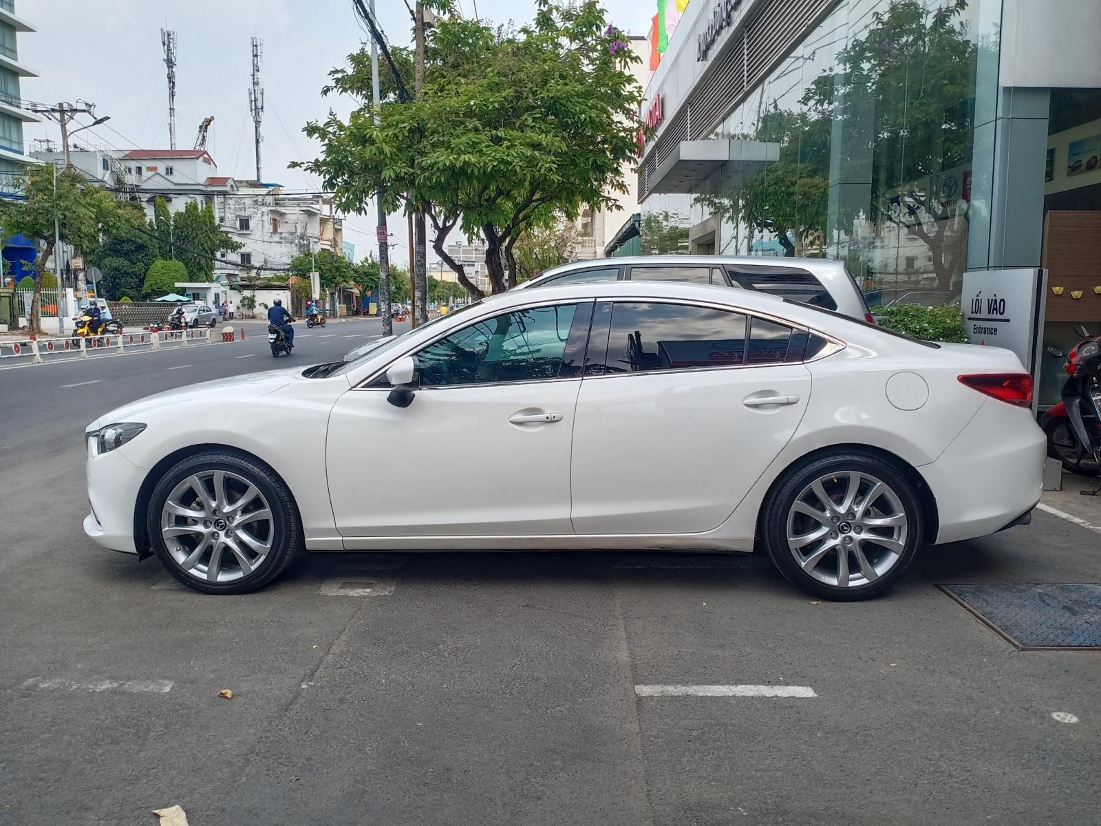 Mazda 6 2015 - Xe Mazda 6 2015, màu trắng, biển SG mới chạy 67.000km, giá chỉ 640 triệu