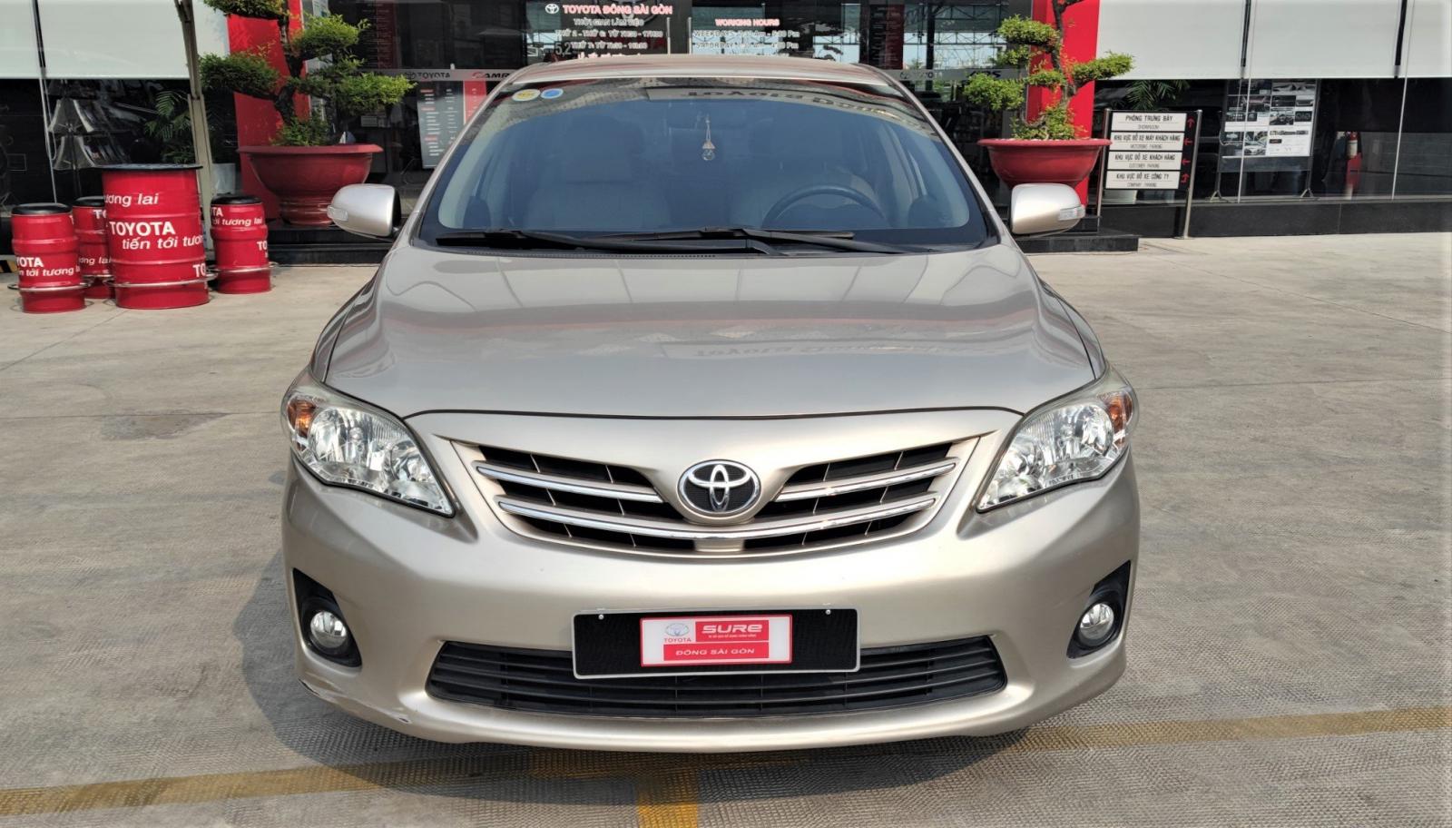 Toyota Corolla altis 1.8G 2014 - Cần bán xe Toyota Corolla Altis 1.8G sản xuất 2014, màu nâu vàng
