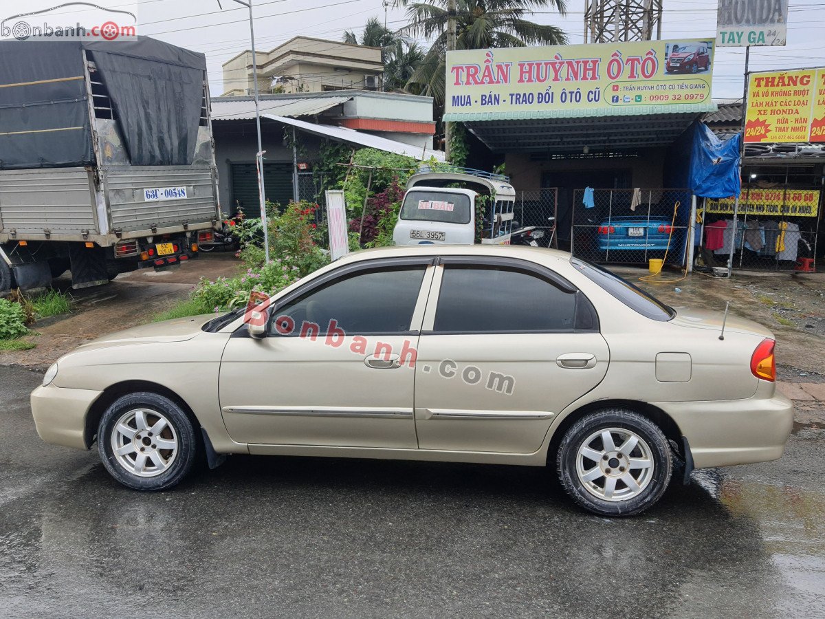 Kia Spectra   1.6 MT  2004 - Xe Kia Spectra 1.6 MT sản xuất năm 2004, màu vàng còn mới, 90 triệu