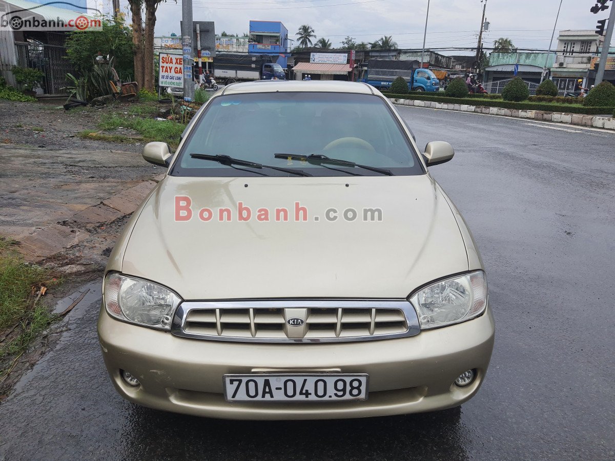 Kia Spectra   1.6 MT  2004 - Xe Kia Spectra 1.6 MT sản xuất năm 2004, màu vàng còn mới, 90 triệu