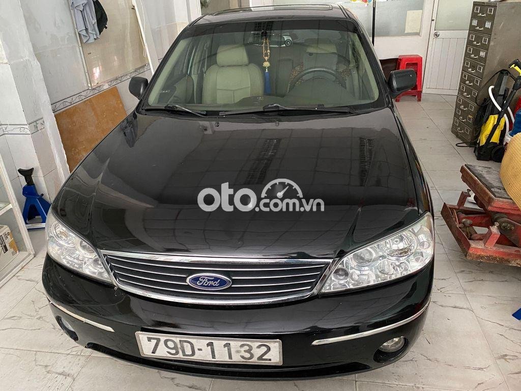 Ford Laser 2004 - Bán xe Ford Laser năm 2004, màu đen, giá chỉ 145 triệu