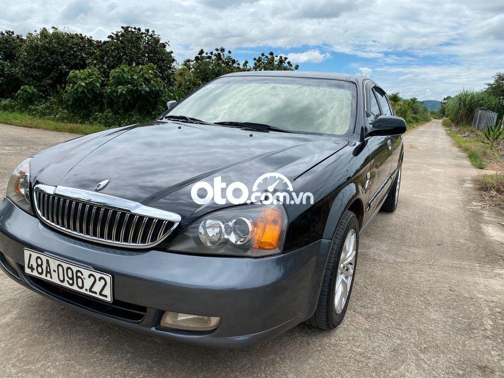 Daewoo Magnus 2004 - Cần bán gấp Daewoo Magnus 2004, màu xám còn mới, giá tốt