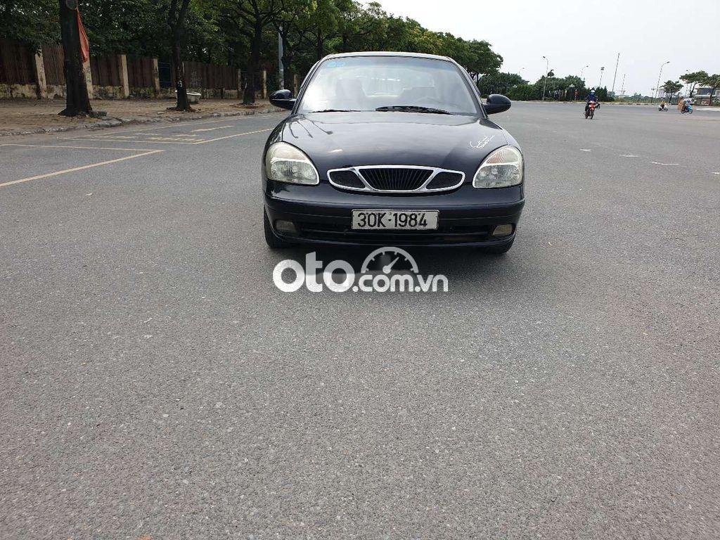 Daewoo Nubira 2002 - Bán ô tô Daewoo Nubira sản xuất 2002, màu đen còn mới giá cạnh tranh