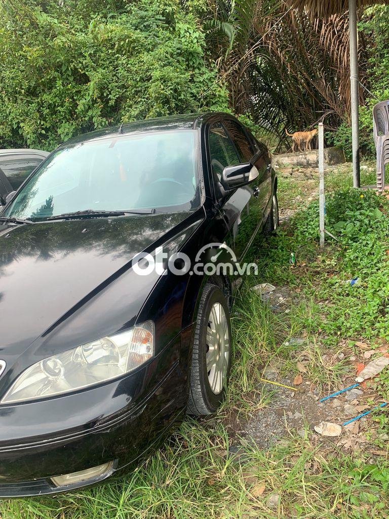 Ford Mondeo 2004 - Bán Ford Mondeo đời 2004, màu đen còn mới, 125tr