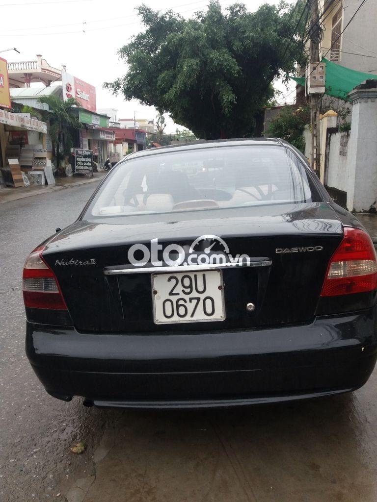 Daewoo Nubira 2004 - Cần bán gấp Daewoo Nubira năm sản xuất 2004, màu đen