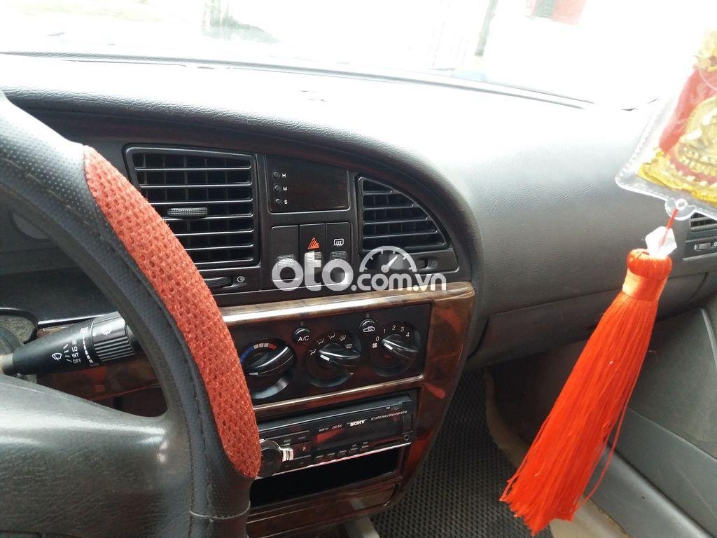 Daewoo Nubira 2004 - Cần bán gấp Daewoo Nubira năm sản xuất 2004, màu đen