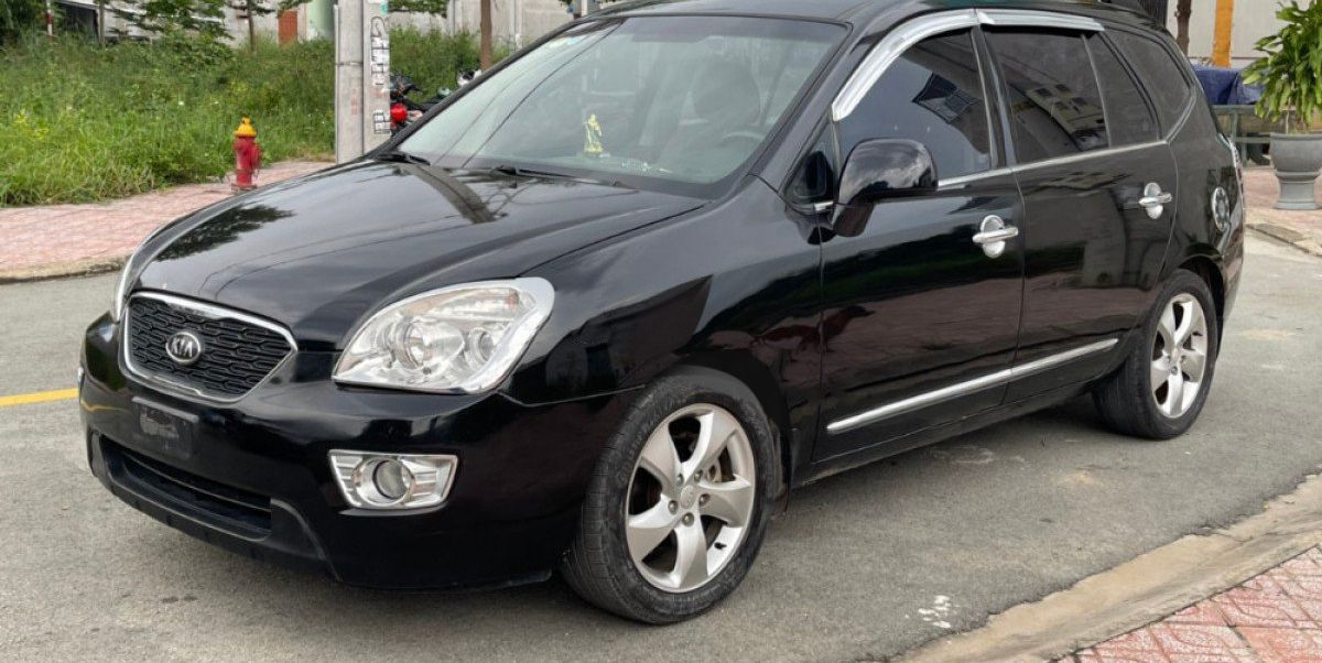 Kia Carens   SX 2.0 AT 2009 - Bán xe Kia Carens SX 2.0 AT năm sản xuất 2009, màu đen còn mới