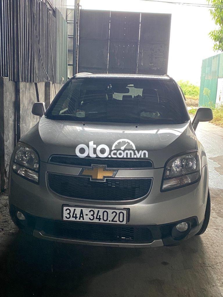 Chevrolet Orlando 2014 - Bán Chevrolet Orlando sản xuất 2014, màu bạc xe gia đình