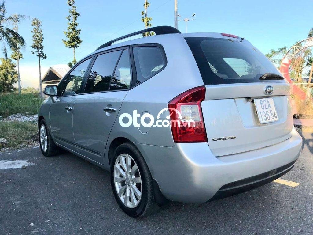 Kia Carens   EX 2.0   2010 - Bán Kia Carens EX 2.0 năm 2010, màu bạc xe gia đình 