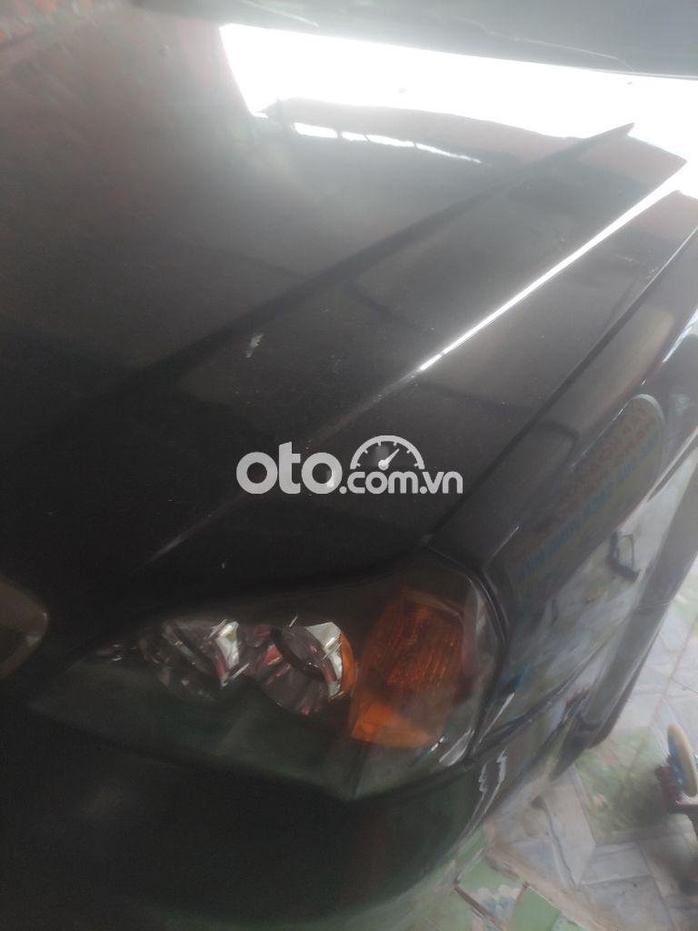 Daewoo Magnus 2004 - Cần bán xe Daewoo Magnus đời 2004, màu đen, nhập khẩu, 85 triệu