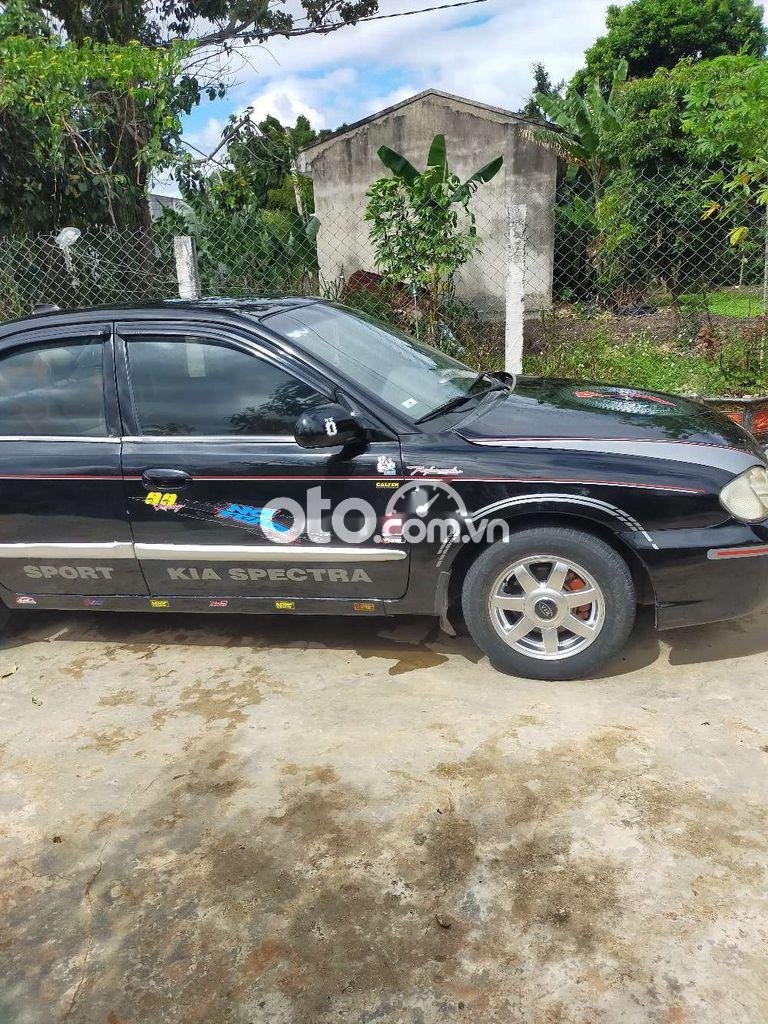 Kia Spectra 2004 - Bán xe Kia Spectra năm sản xuất 2004, màu đen, nhập khẩu, 87 triệu