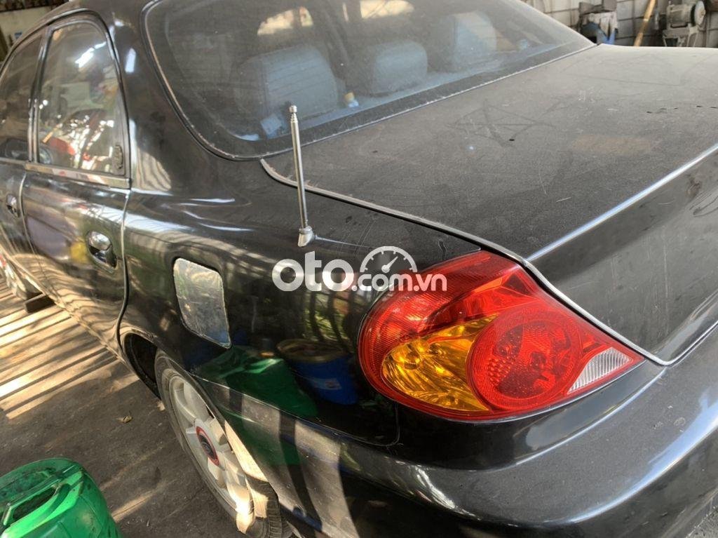 Kia Spectra 2003 - Bán xe Kia Spectra sản xuất 2003, màu đen